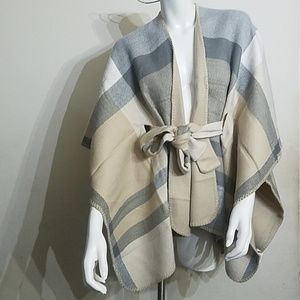 Brand new women's reversible belted wrap. One size